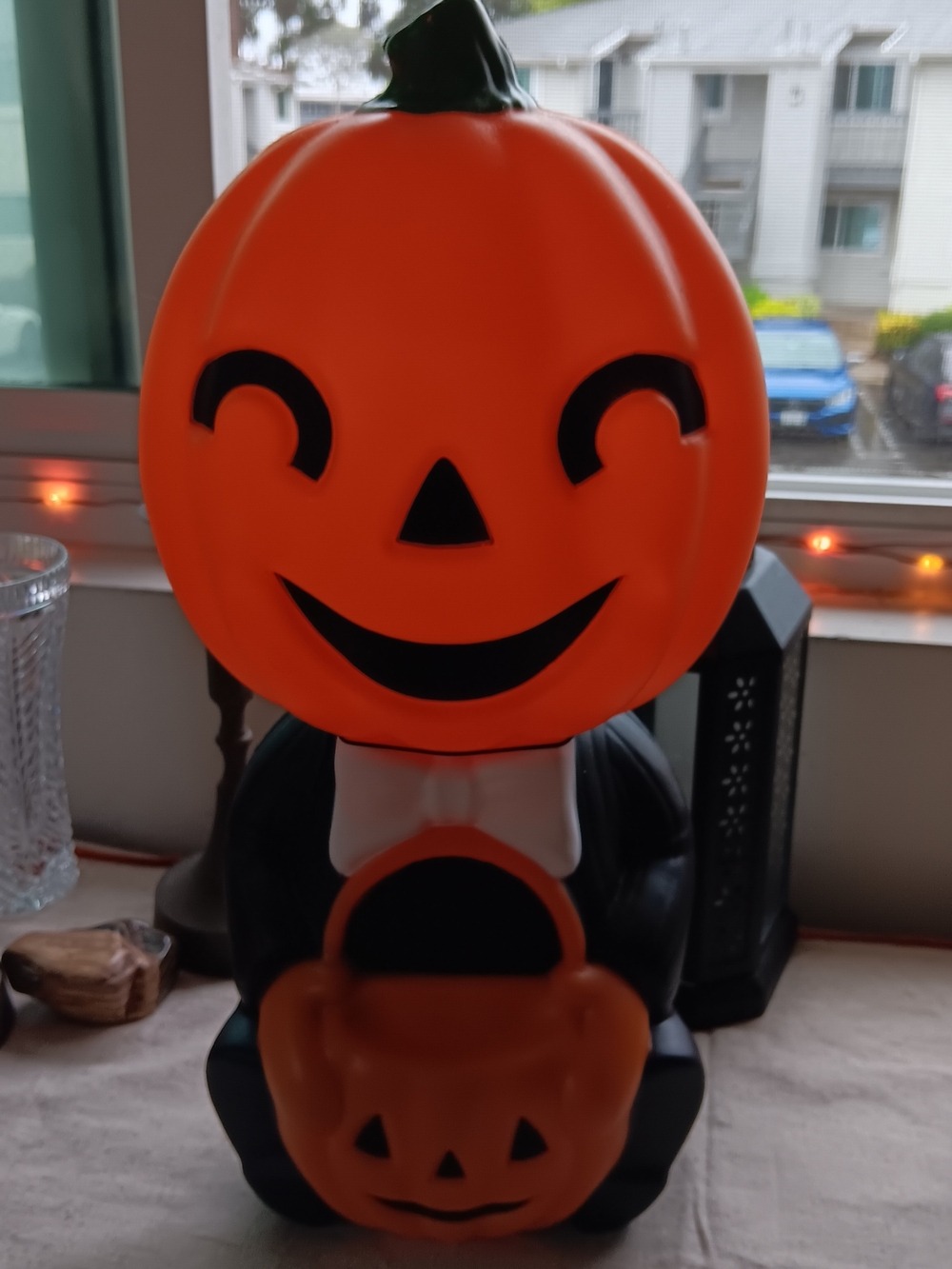 Smiling Orange Pumpkin Halloween Figurine with Candy Basket